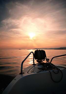Boat on Water at Sunset