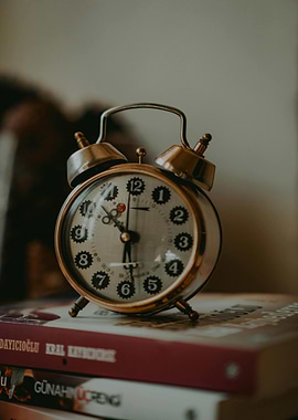 Vintage Alarm Clock on Books