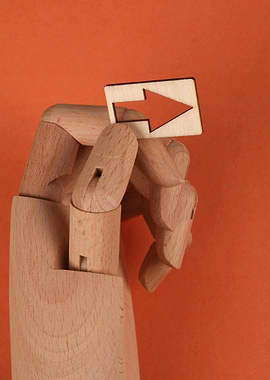 Wooden Hand Holding Arrow Sign