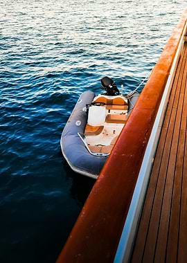 Inflatable boat tied to a yacht