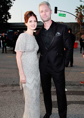 Lana Del Rey and man in suits