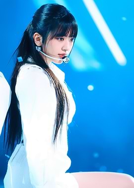 Young woman with microphone on stage