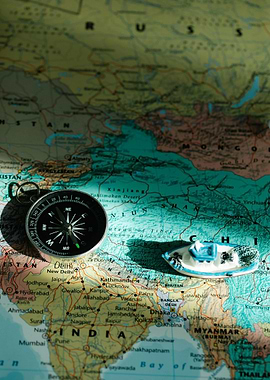 Compass and Boat on World Map