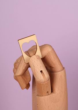 Wooden Hand Holding Heart Ring