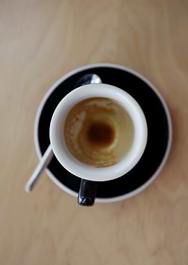 Espresso cup on wooden table