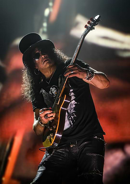 Slash playing guitar on stage