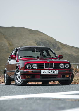 Red BMW E30 on Mountain Road