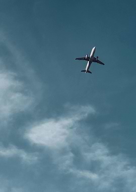 Airplane in the sky with clouds