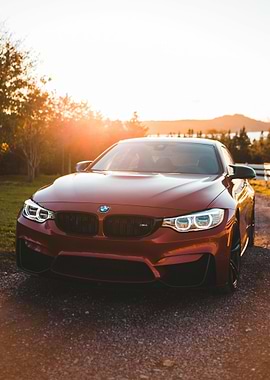 Red BMW M4 at Sunset