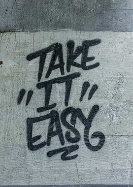 Take It Easy Graffiti on Concrete Wall