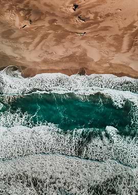 Aerial view of ocean waves and beach