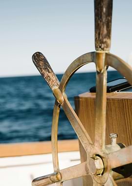 Boat steering wheel on the water