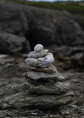 Stacked Stones Cairn on Rocky Shore