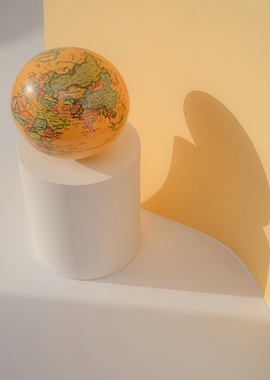 Globe on White Pedestal Still Life