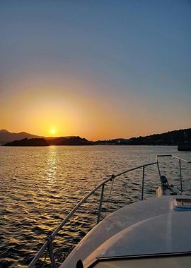 Boat at Sunset on the Water