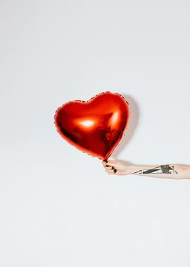Red Heart Balloon with Tattooed Arm