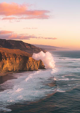 Coastal Cliffs and Crashing Waves at Sunset