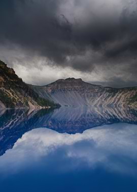 Crater Lake Reflection Under Stormy Sky