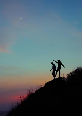 Silhouette of Two People at Sunset