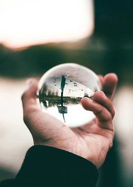 Crystal ball reflecting a park scene