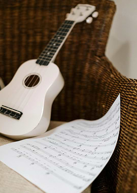 Ukulele and Sheet Music Still Life