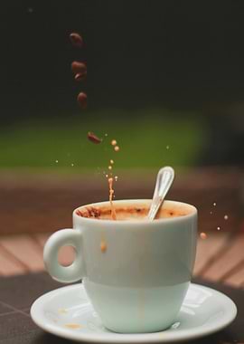 Coffee splash with beans falling