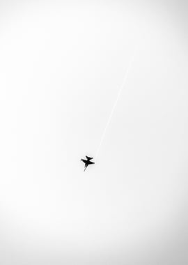 Fighter jet with contrail in monochrome