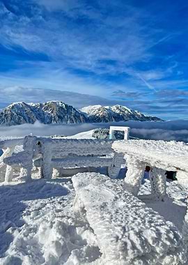 Snowy Mountain Vista with Iced Picnic Table