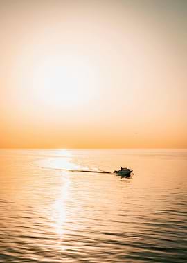 Boat on Water at Sunset
