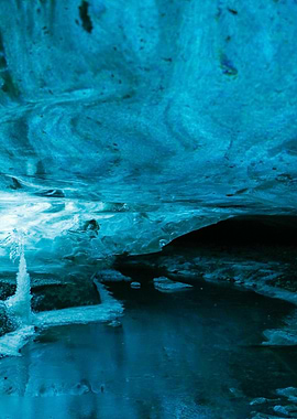 Ice cave with water stream