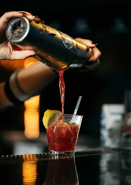 Cocktail being poured into glass