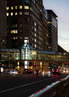 Cityscape at Night with Pedestrian Bridge