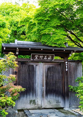 Traditional Japanese Wooden Gate with Greenery