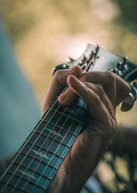 Guitar Player's Hand on Fretboard