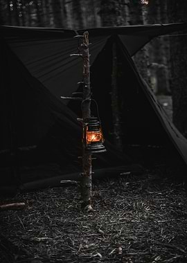 Camping Lantern in Dark Forest Setting
