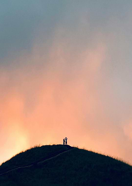 Hilltop silhouettes at sunset