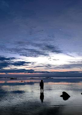 Silhouette on Water at Dusk
