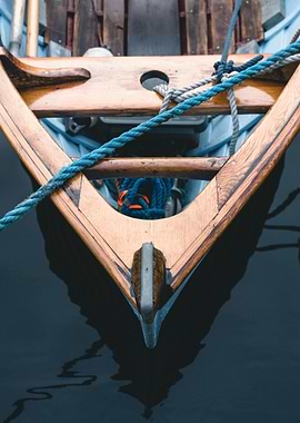 Wooden Boat Bow in Dark Water