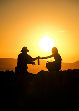 Sunset Silhouette: Sharing a Drink