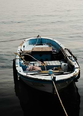 Small Blue Fishing Boat on Water