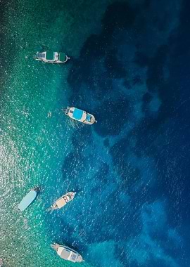 Aerial View of Boats on Blue Water