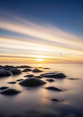 Sunset over rocky beach