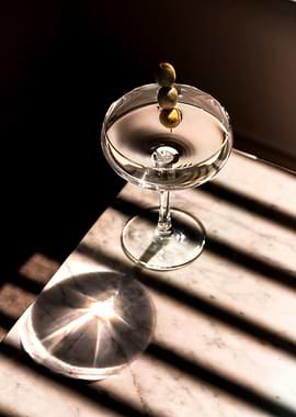 Martini with Olives on Marble Table
