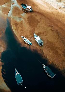 Aerial View of Boats on Riverbank