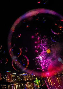 Fireworks and Bubbles over Cityscape at Night
