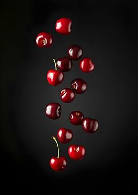 Falling Cherries on Black Background