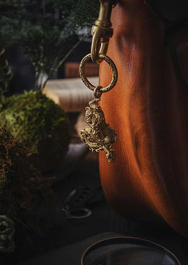 Golden Dragon Keychain on Leather Bag