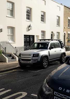 Silver Land Rover Defender parked in London