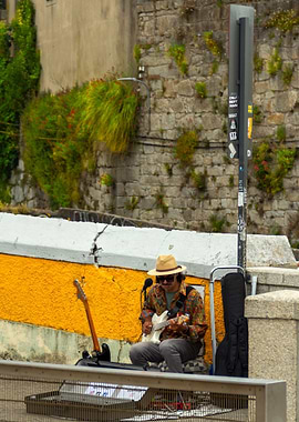 Street Musician Playing Guitar Outdoors