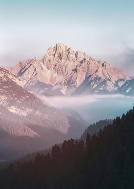 Mountain peak with fog and trees